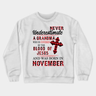 Never Underestimate A Grandma Blood Of Jesus November Crewneck Sweatshirt